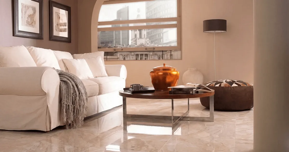 Modern living room with professionally installed marble flooring, a beige sofa, coffee table in Baton Rouge, LA